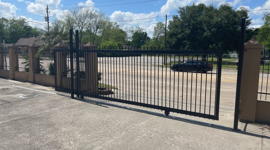 Commercial iron slide gate at a business entrance in Baytown, TX