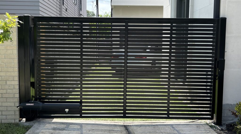 Horizontal-slat steel swing gate automated with a LiftMaster LA500 operator, installed in The Heights, Houston, TX