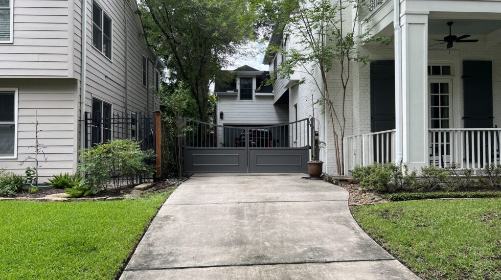 Iron swing driveway gate at a residential drive